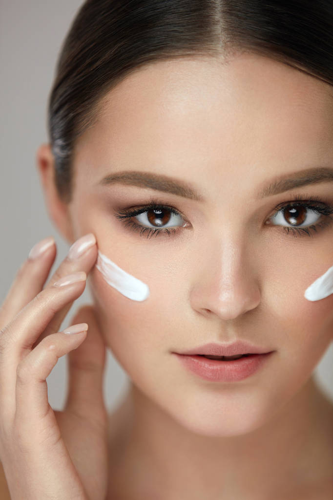 Beauty Cosmetics. Sexy Girl Face With Cosmetic Cream On Skin - Photo, Image