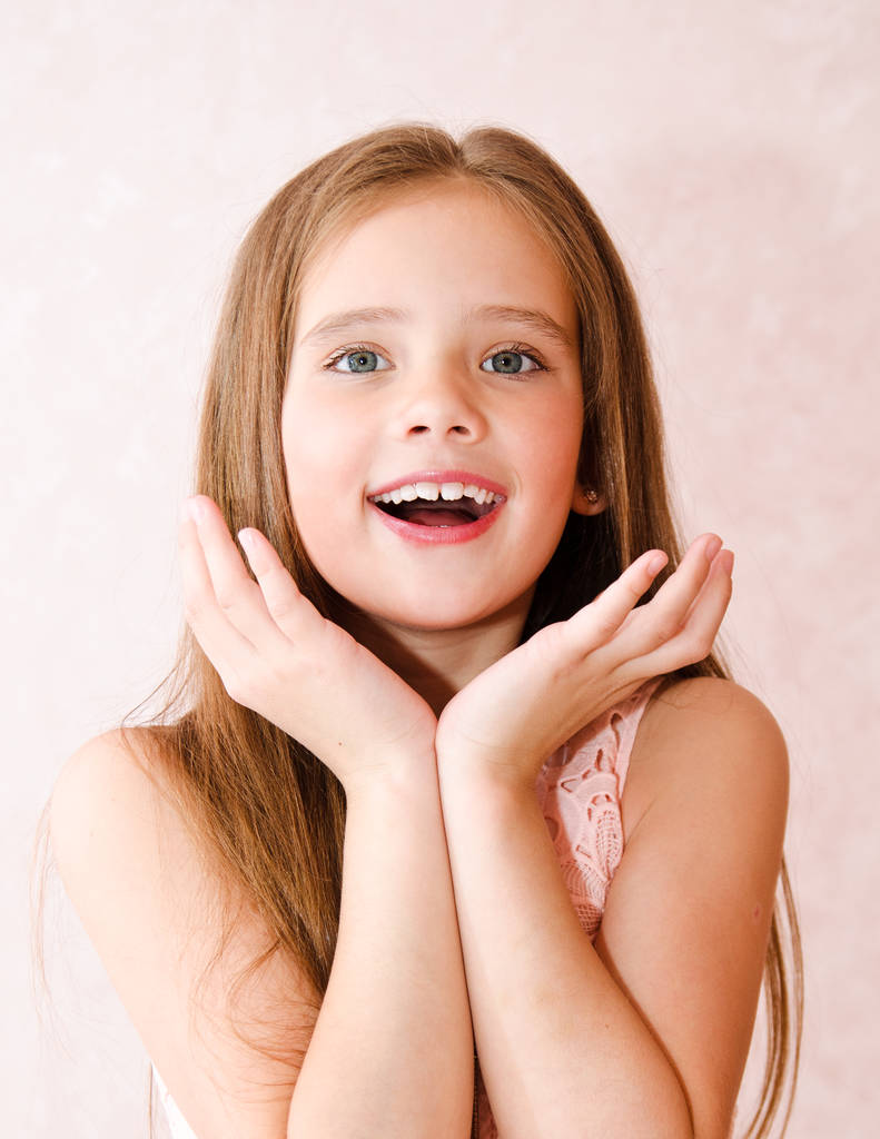 Portrait of adorable surprised happy little girl  - Photo, Image