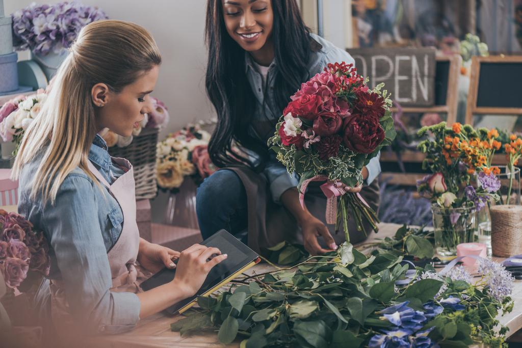 multiethnic florists in flower shop - Photo, Image