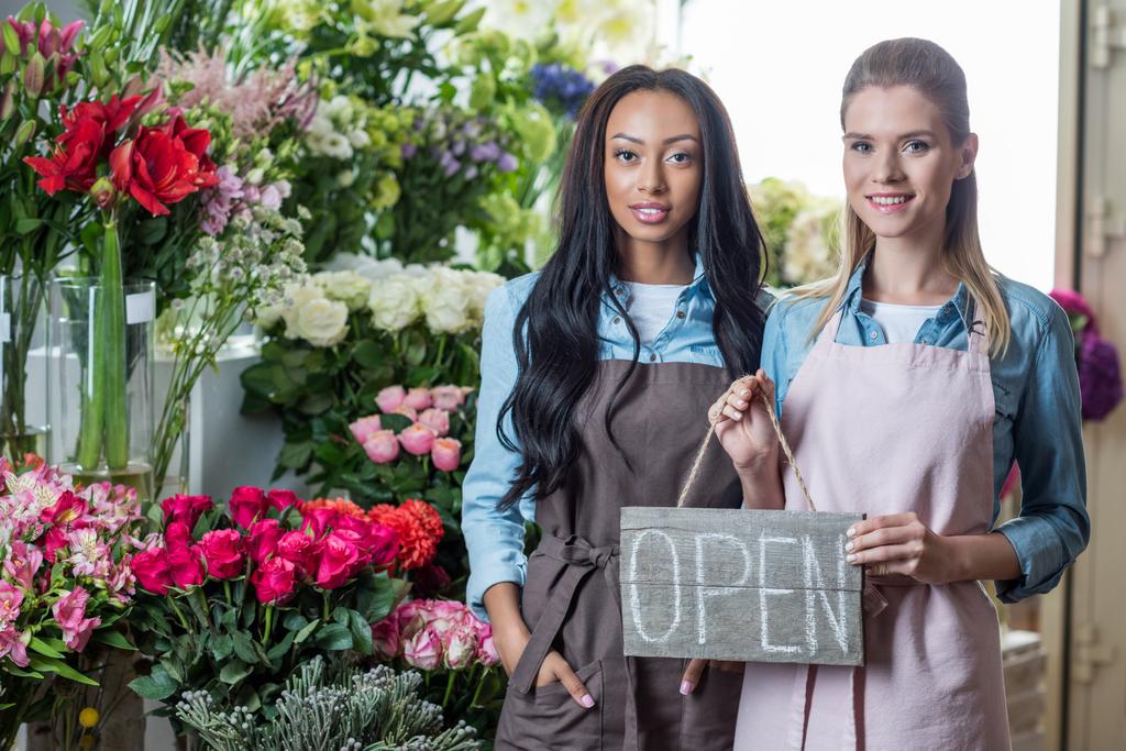 multiethnic florists with open sign - Photo, Image