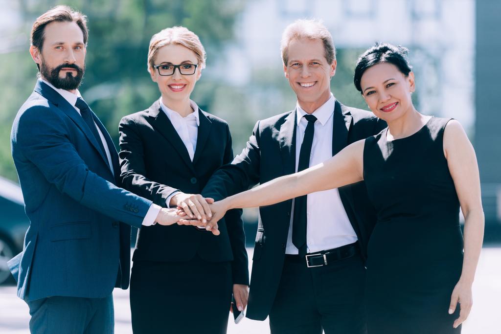 multiethnic businesspeople stacking hands - Photo, Image