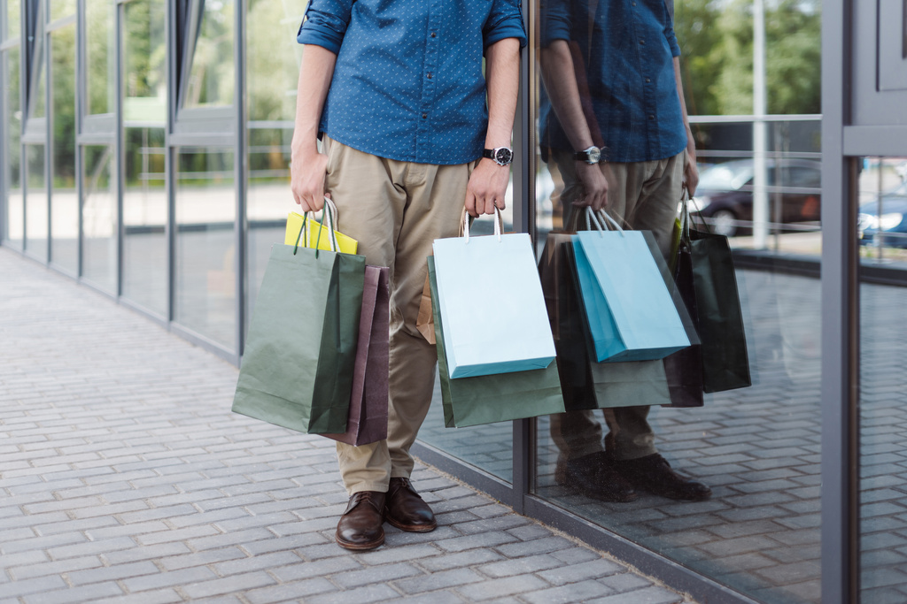 young man with shopping bags - Photo, Image