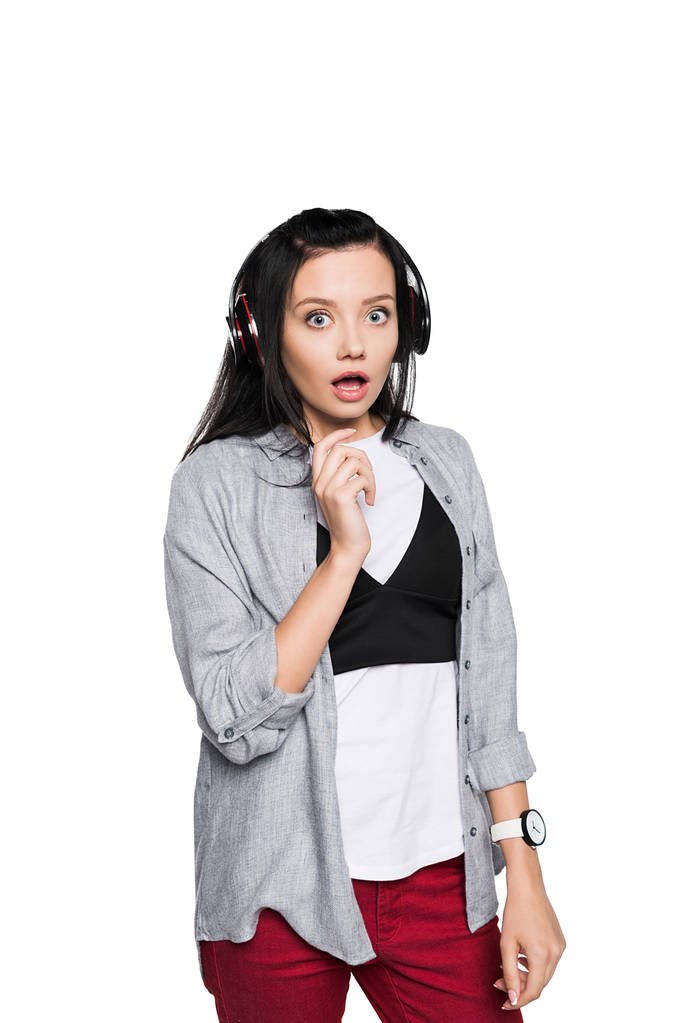 шокована дівчина в навушниках
 - Фото, зображення