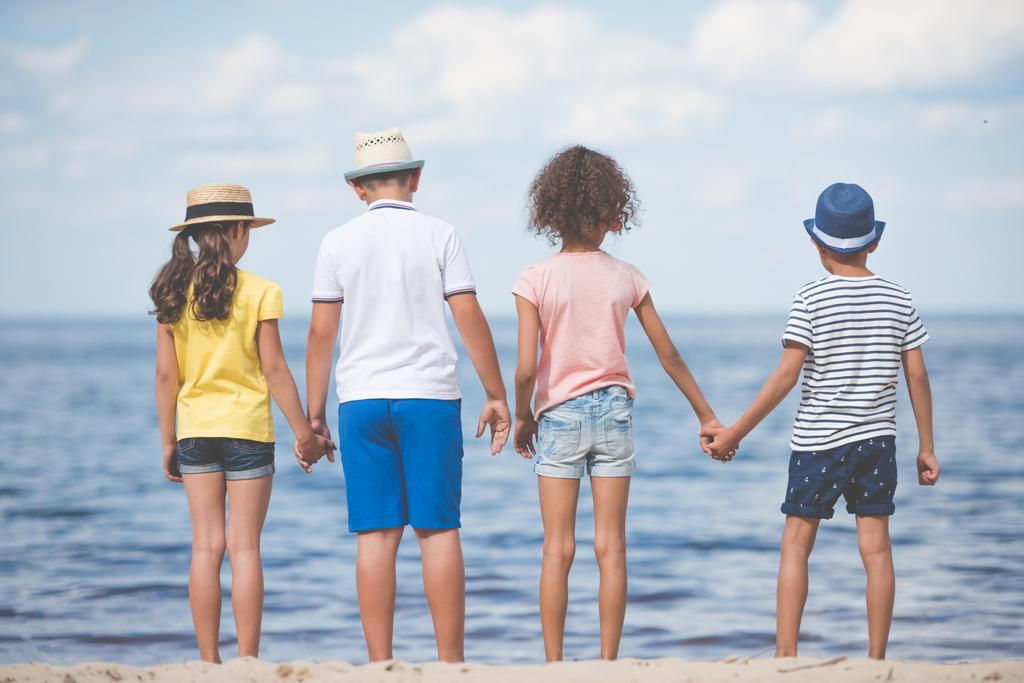 children standing at seaside - Photo, Image