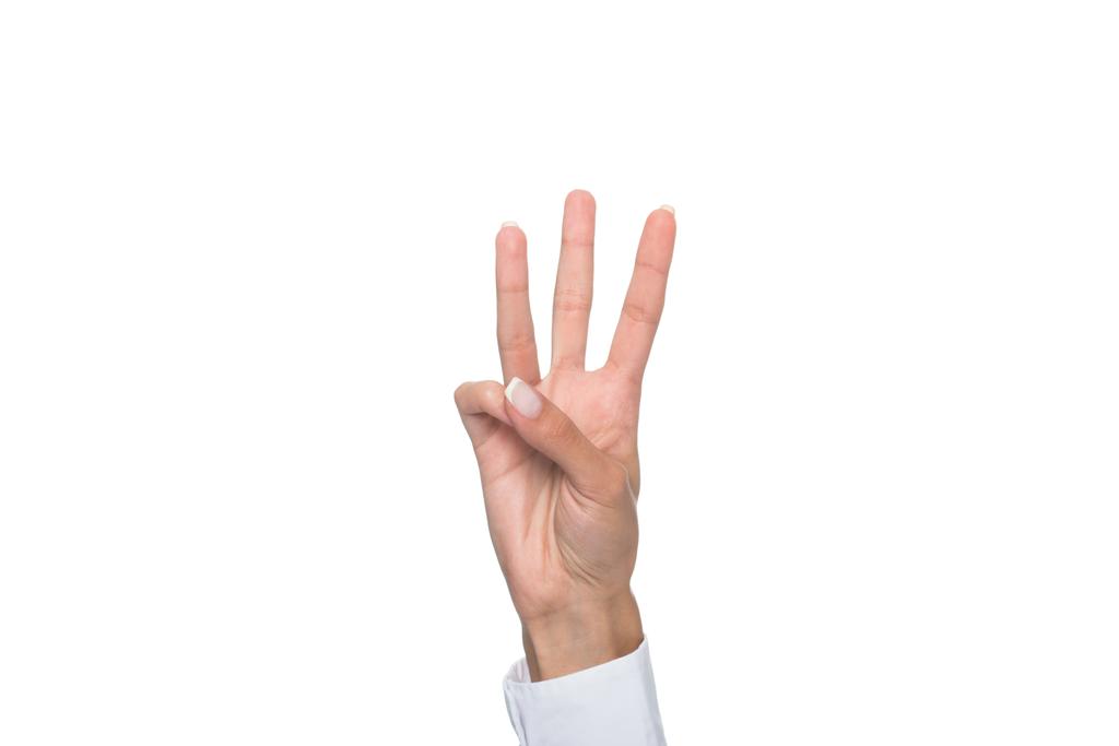 persona mostrando tres signos
  - Foto, Imagen