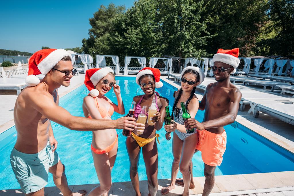 Multiethnic people at Christmas pool party  - Photo, Image