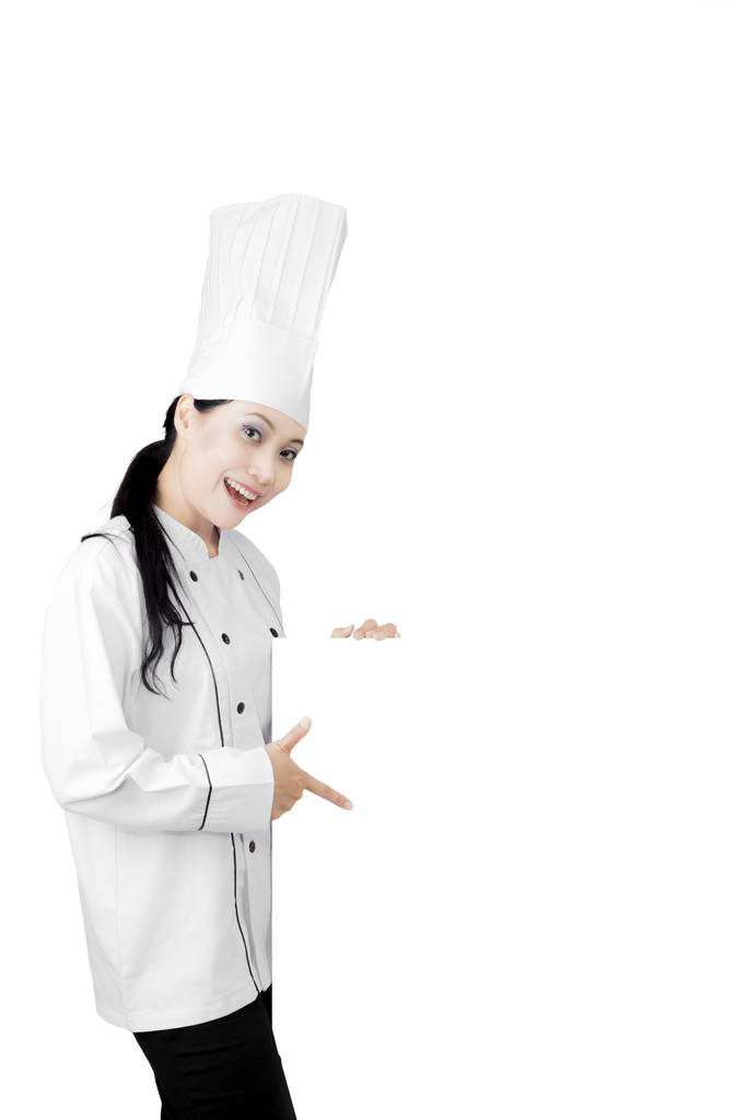 Красивый повар показывает чистый рекламный щит
 - Фото, изображение