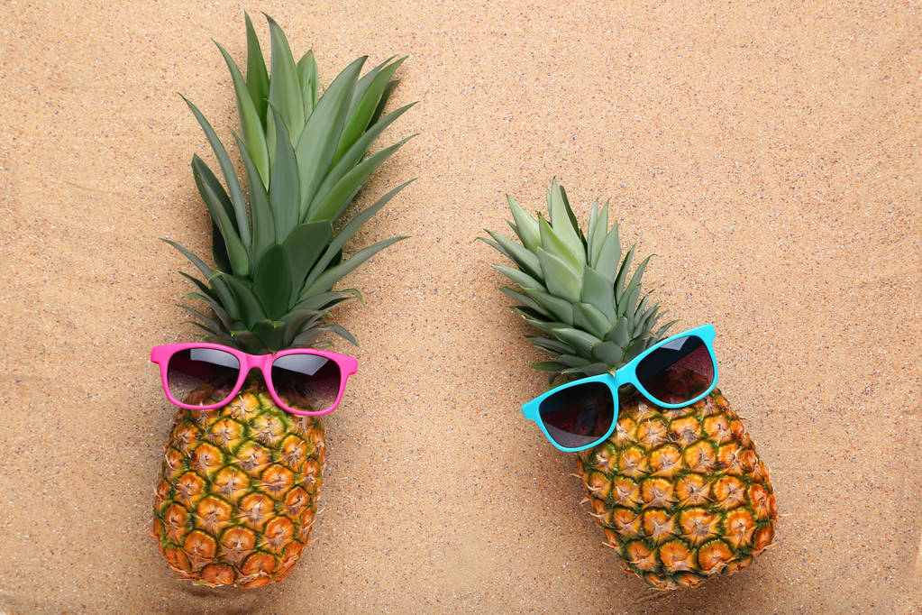 Ripe pineapples with sunglasses - Photo, Image