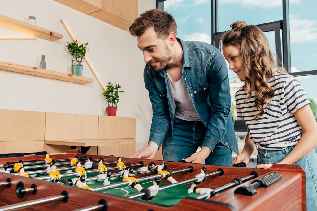father and daughter playing table football - Photo, Image