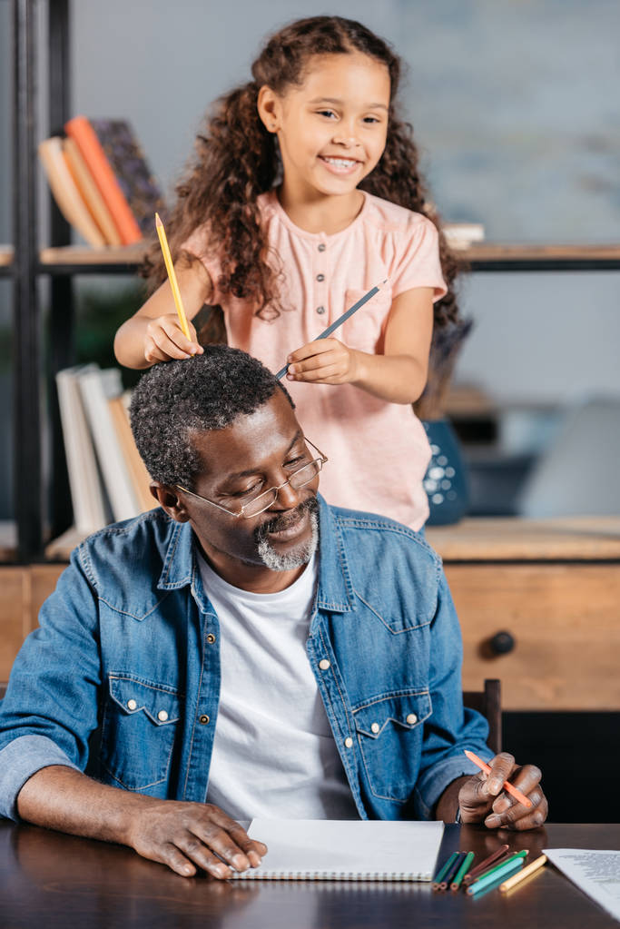 African american man drawing with daughter - Photo, Image