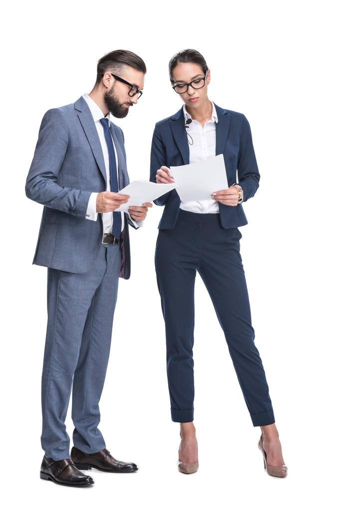 businesspeople in suits looking at papers - Photo, Image