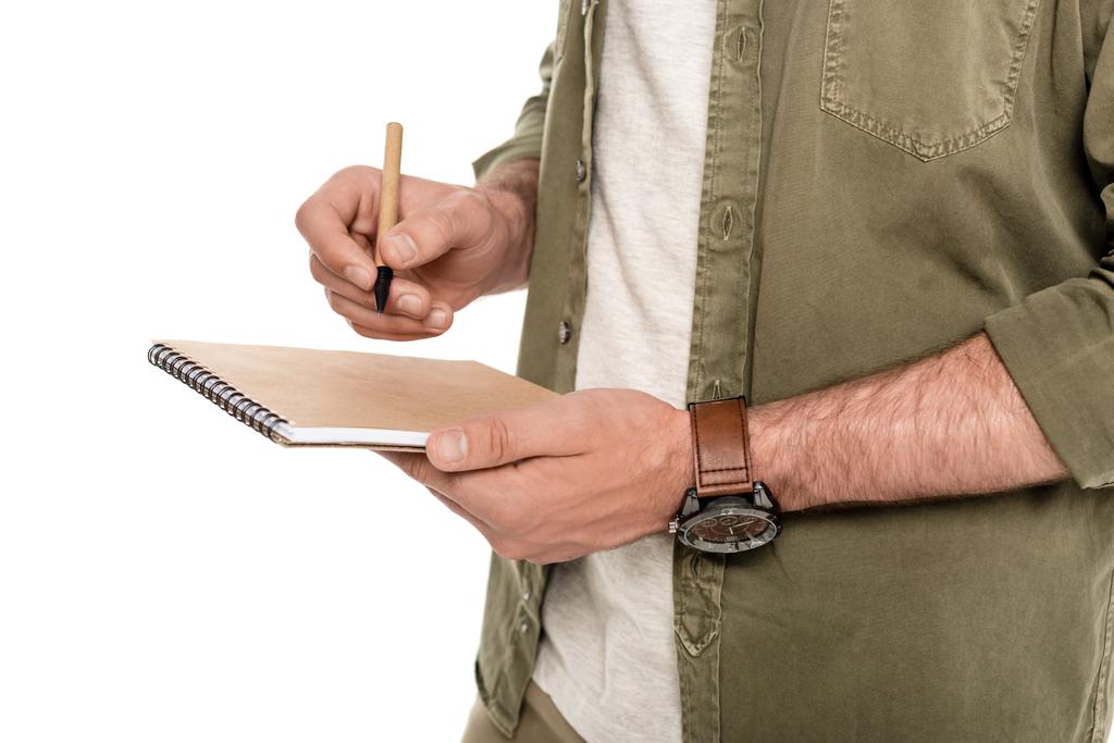 Человек с ноутбуком и ручкой в руках
 - Фото, изображение
