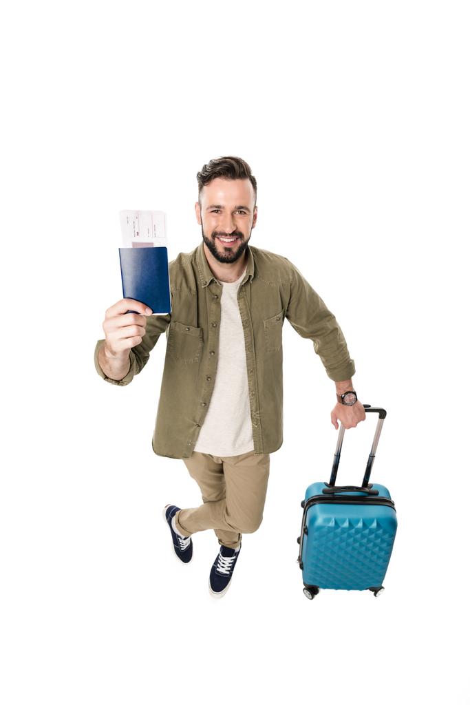homem com mala, passaporte e bilhetes
 - Foto, Imagem