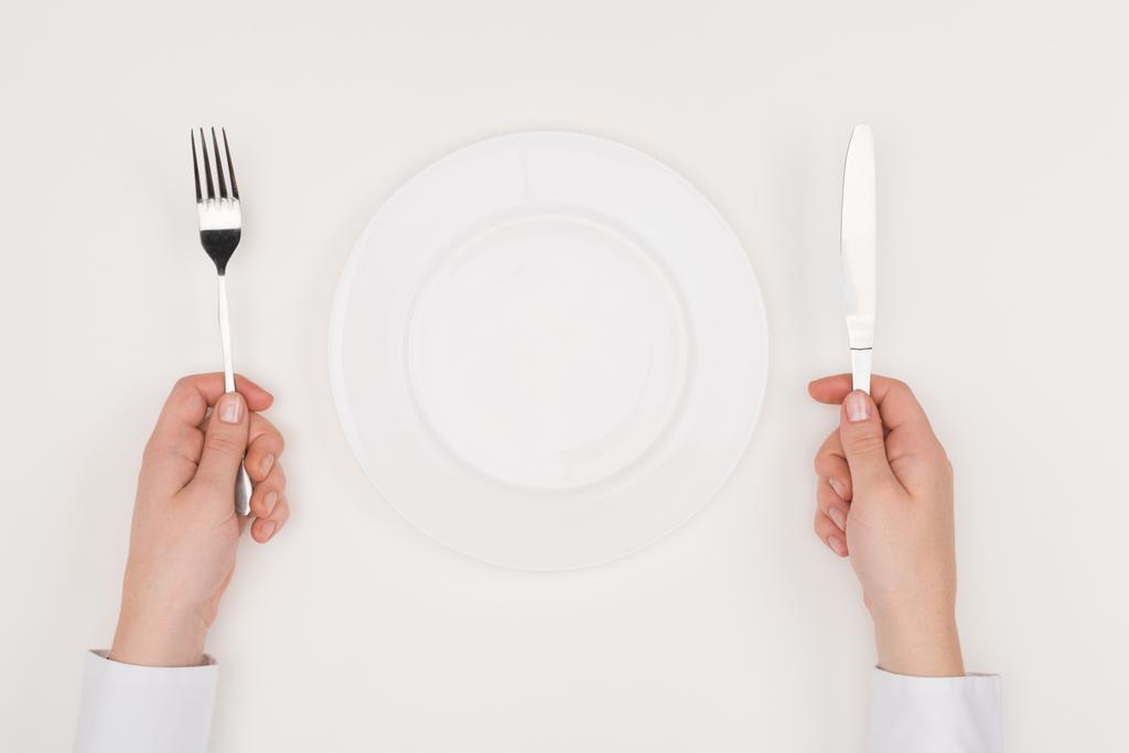 hands, empty plate and cutlery - Photo, Image