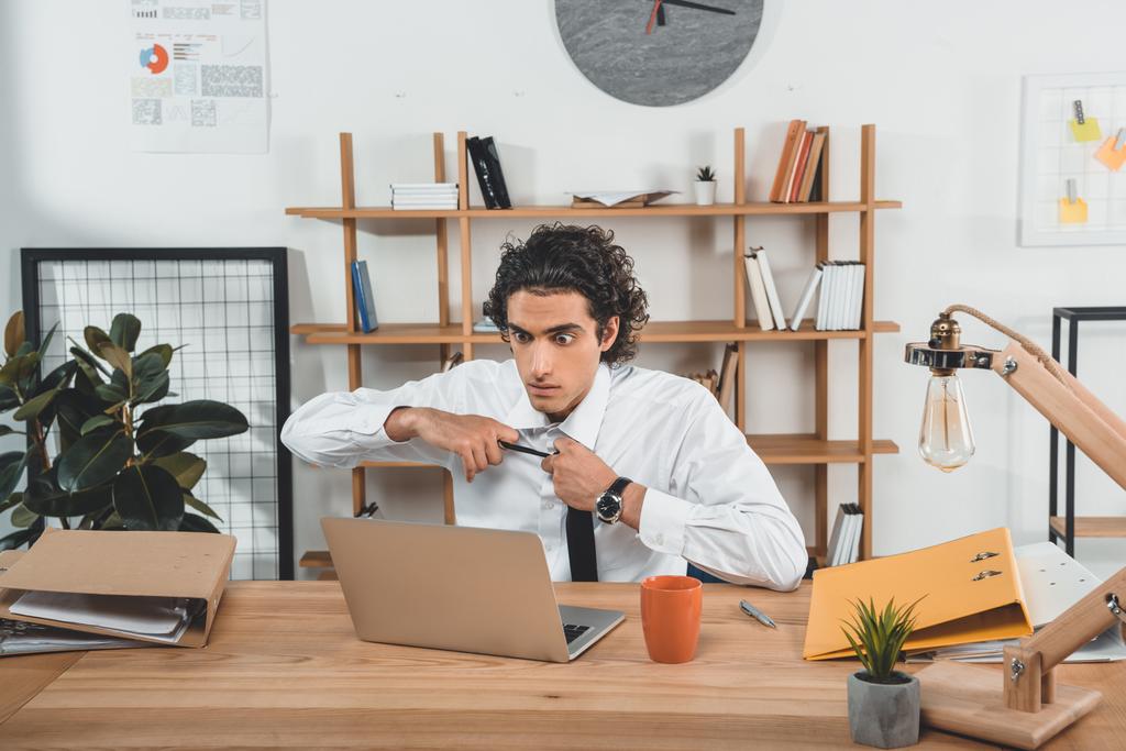 businessman sitting at workplace with laptop - Photo, Image