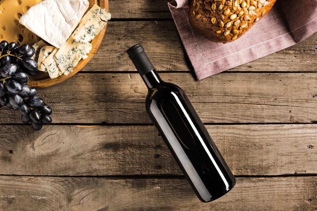 bottle of wine, bread and cheese - Photo, Image