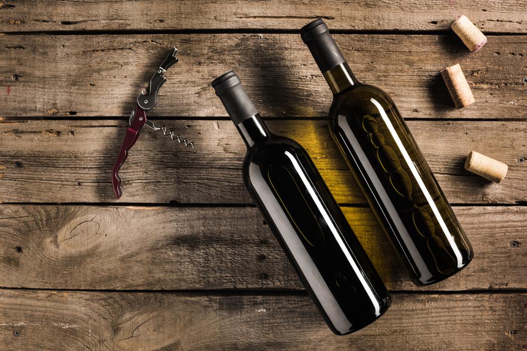 bottle of red wine and corkscrew - Photo, Image