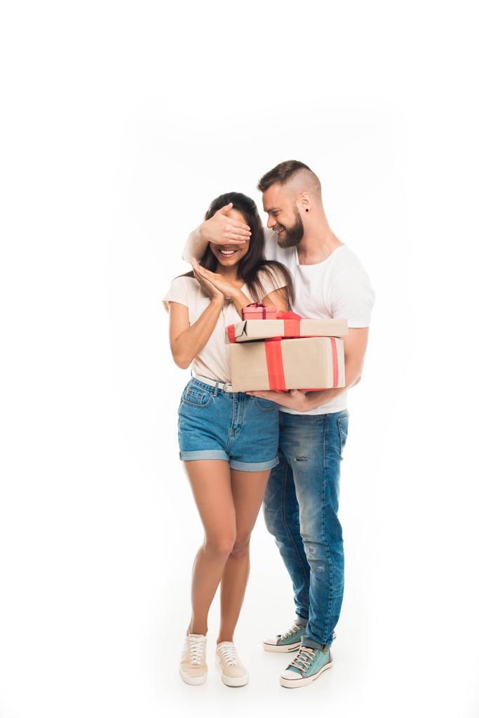 man surprising girlfriend by gifts - Photo, Image