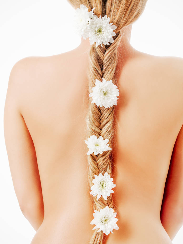 beautiful young girl with long hair with flowers in braid - Photo, Image