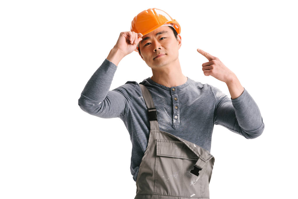 bouw werknemer ponting op helm - Foto, afbeelding
