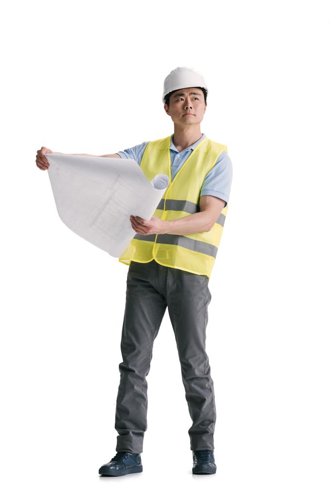 молодой азиатский архитектор со строительным планом
 - Фото, изображение