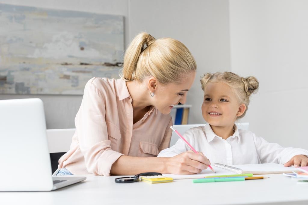 mother and daughter drawing together - Photo, Image