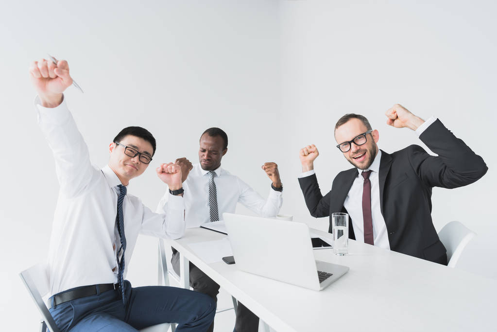 multicultural excited businessmen at workplace - Photo, Image