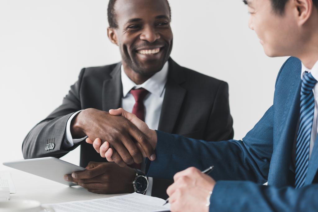 multiethnic businessmen shaking hands - Photo, Image