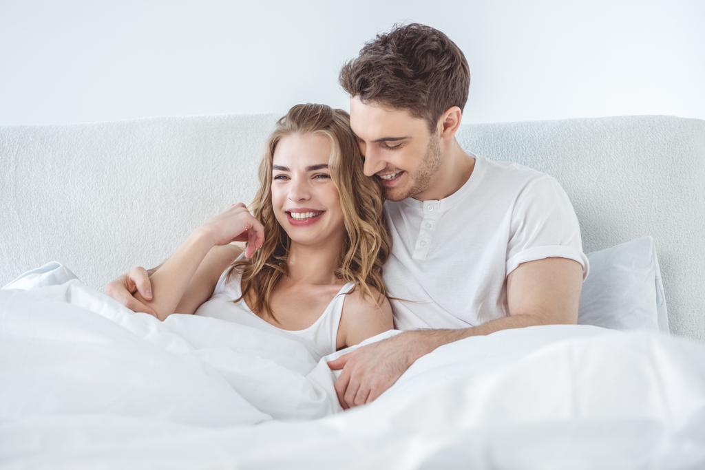 couple hugging in bed - Photo, Image