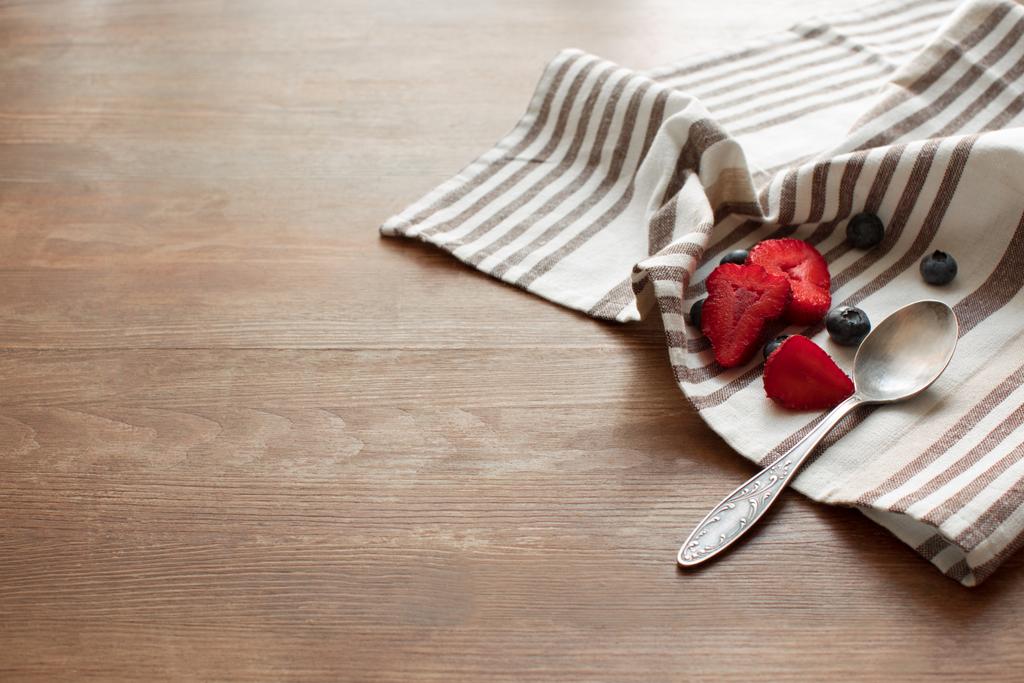 berries and spoon on napkin - Photo, Image