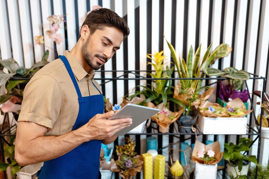 male florist with digital tablet  - Photo, Image
