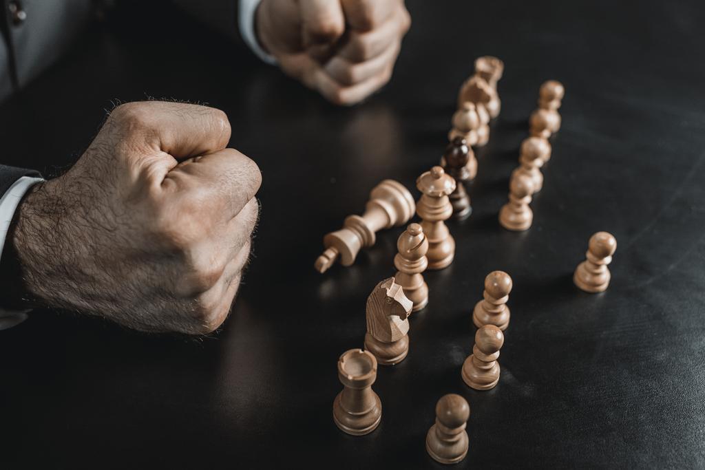 businessman and chess figures on table - Photo, Image