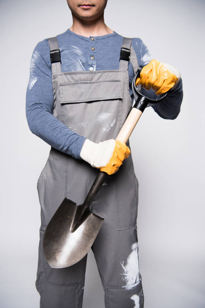 Construction worker holding shovel - Photo, Image