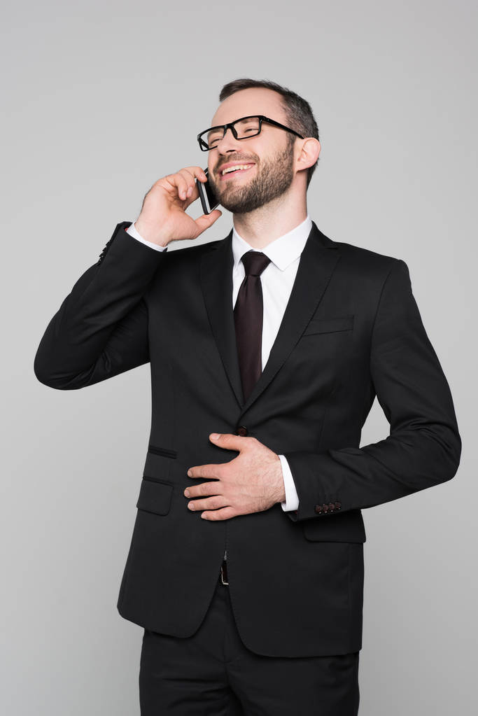 Businessman laughing and talking on phone - Photo, Image