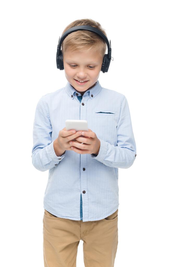 Älypuhelinta käyttävä lapsi
 - Valokuva, kuva