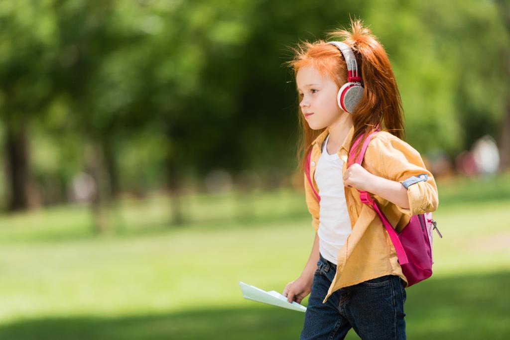 redhead schoolchild in headphones - Photo, Image