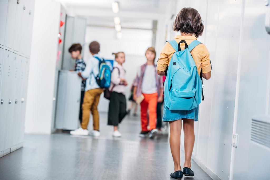 girl with backpack in school - Photo, Image