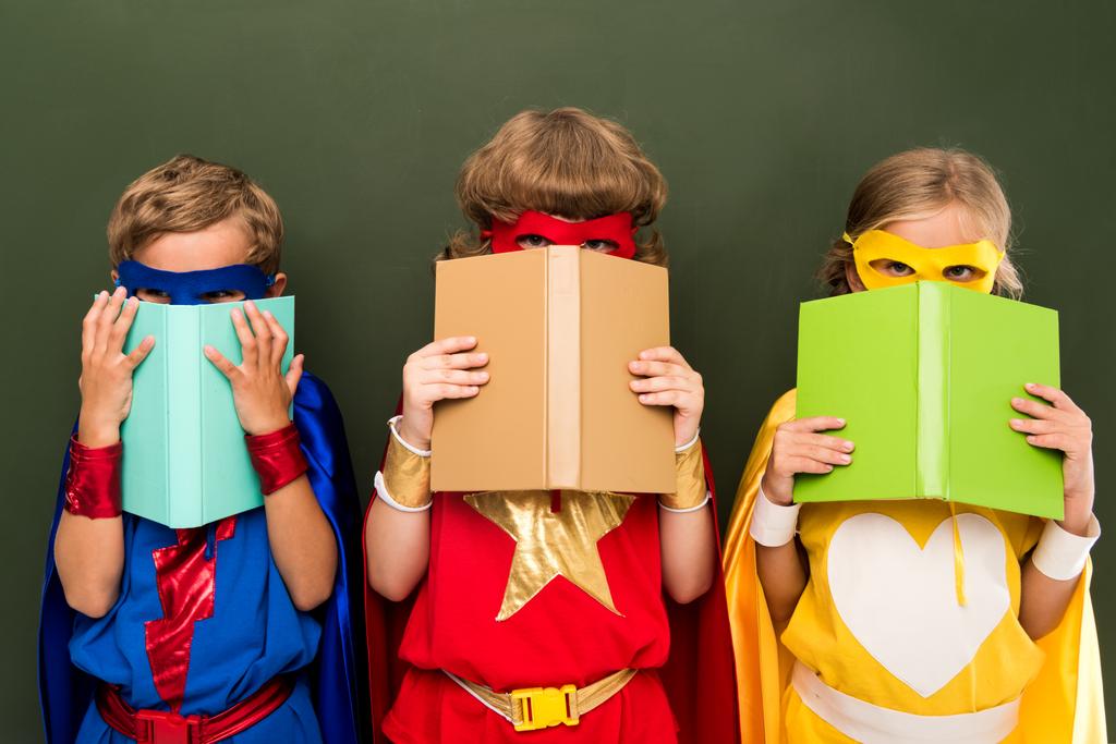 little superheroes with books - Photo, Image