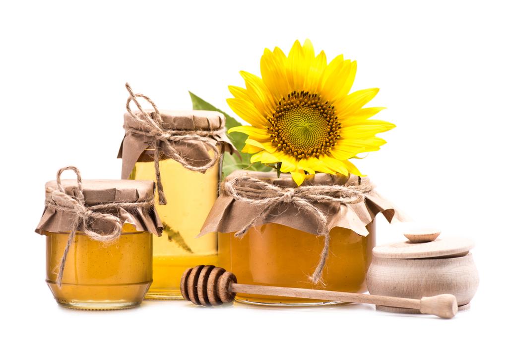 girasol y miel en frascos de vidrio
  - Foto, imagen