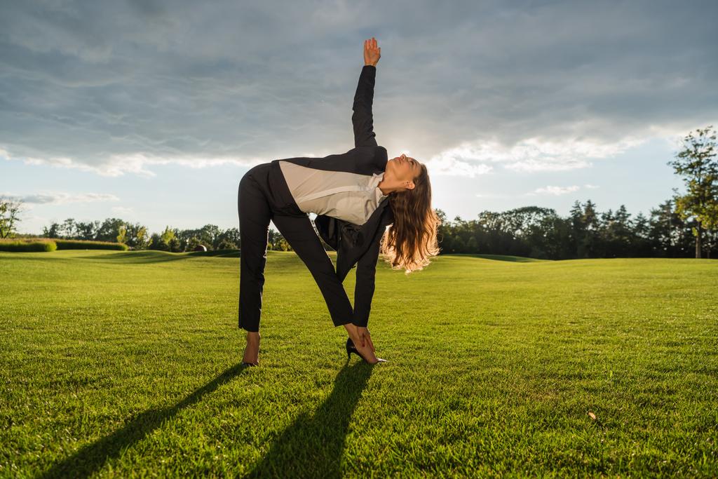 businesswoman standing in yoga pose - Photo, Image