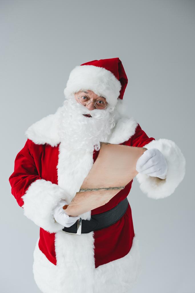 Санта Клаус зі списком бажань
 - Фото, зображення