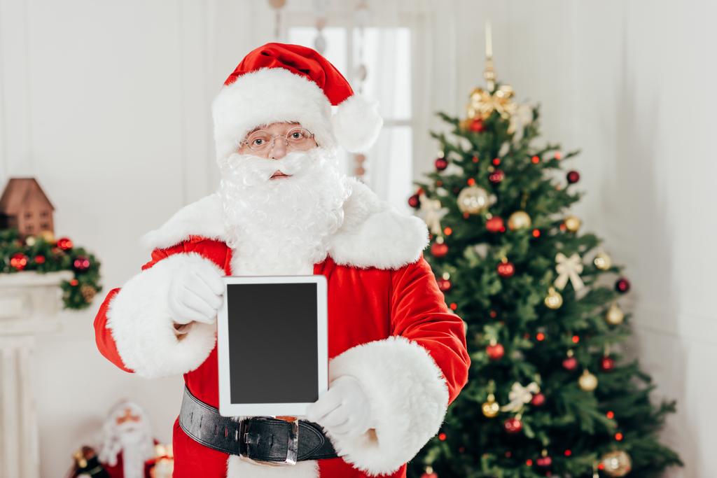 Santa Claus presentando la tableta
 - Foto, imagen
