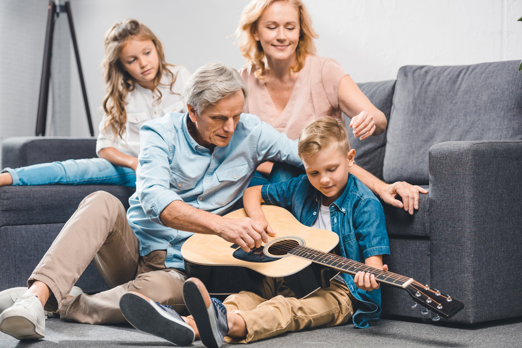 family playing on guitar - Photo, Image