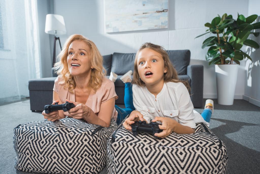 grandmother and granddaughter with joysticks   - Photo, Image
