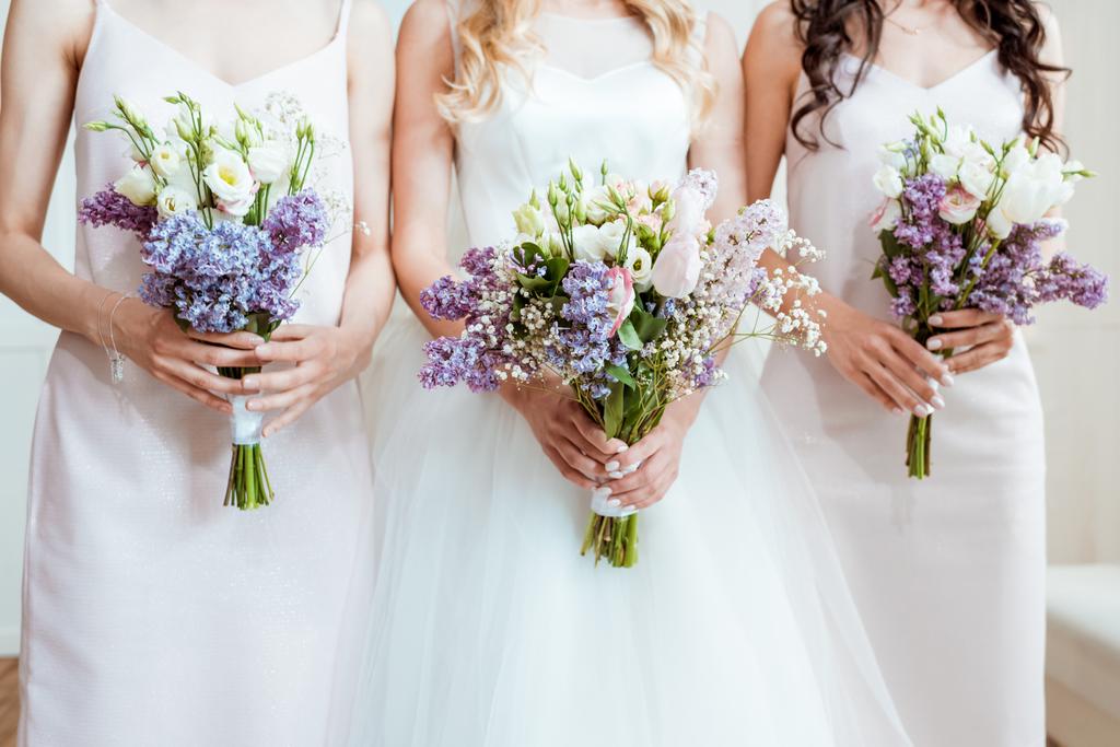 bride with bridesmaids holding bouquets - Photo, Image