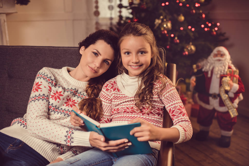 mother and daughter reading book - Photo, Image