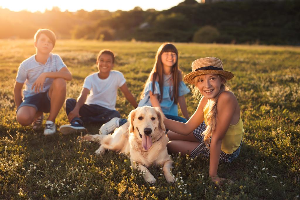 teenagers with dog in park - Photo, Image