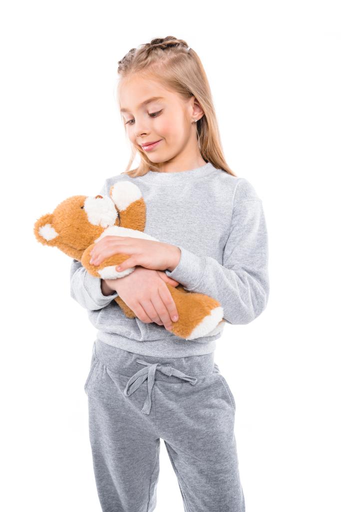 дитина носить плюшевого ведмедя
 - Фото, зображення