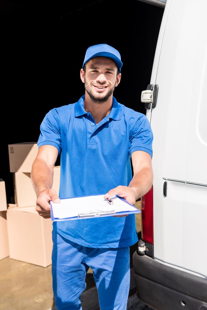 delivery man with clipboard - Photo, Image