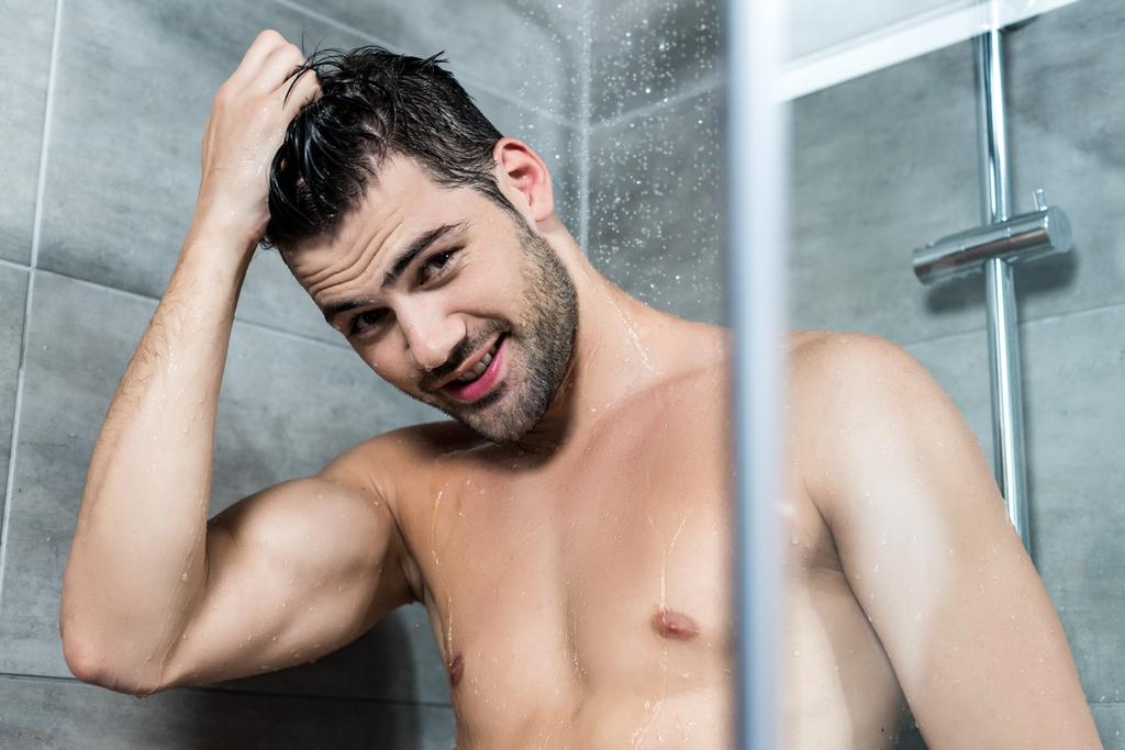 young man taking shower - Photo, Image